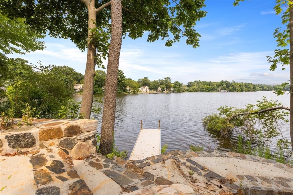 46 Crescent Avenue Lynnfield, MA 01940 - Photo 15 of 16 a view of a lake with houses in back