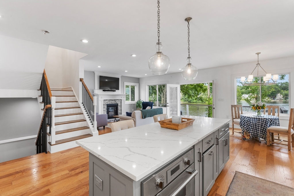 46 Crescent Avenue Lynnfield, MA 01940 - Photo 2 of 16 a view of a kitchen with furniture and a wooden floor