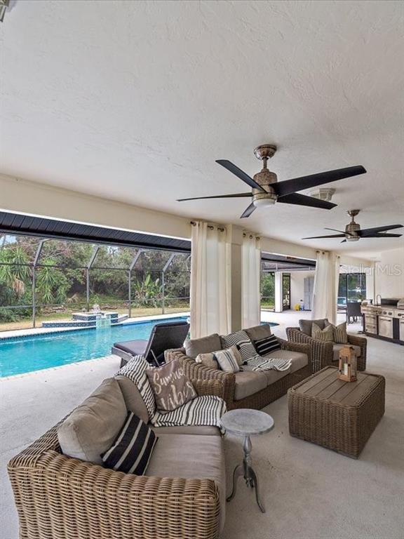 4588 Baycedar Lane Sarasota, FL 34241 - Photo 19 of 36 a living room with furniture and a large window