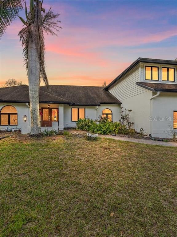 4588 Baycedar Lane Sarasota, FL 34241 - Photo 2 of 36 a front view of house with yard and ocean