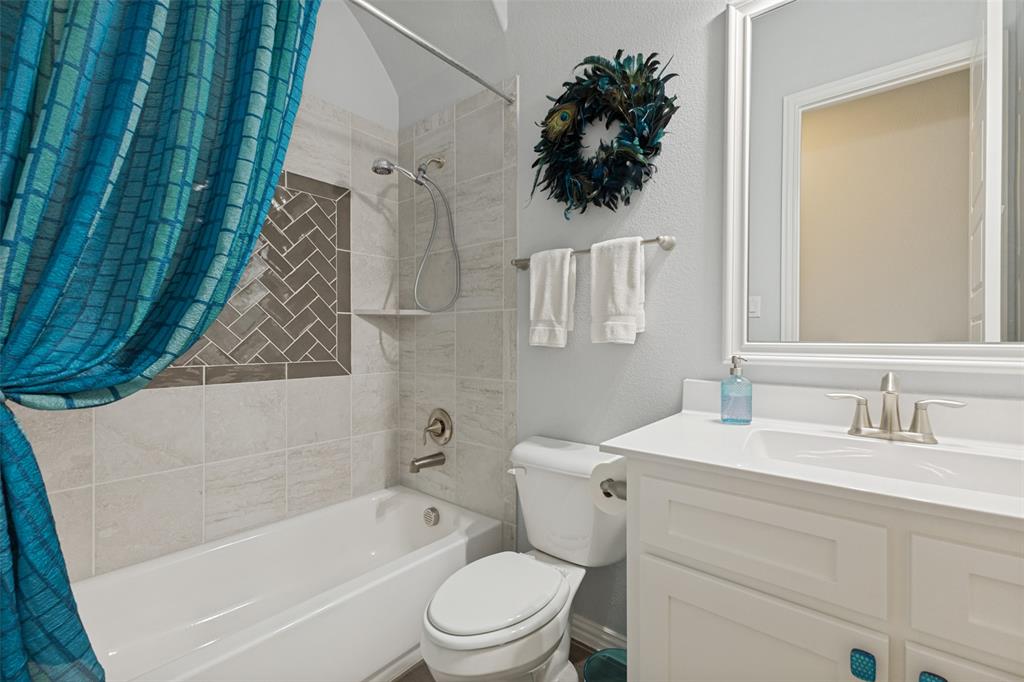 506 Life Spring Drive Rockwall, TX 75087 - Photo 29 of 36 a bathroom with a sink mirror vanity and toilet