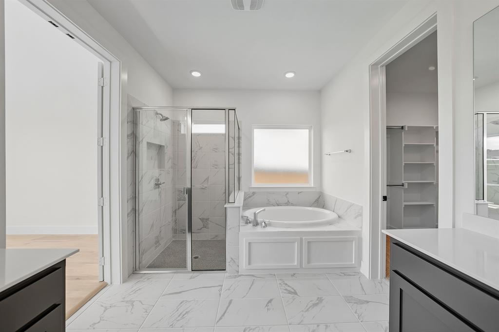 587 Mayfair Lane Frisco, TX 75033 - Photo 20 of 37 a bathroom with a sink a toilet and shower