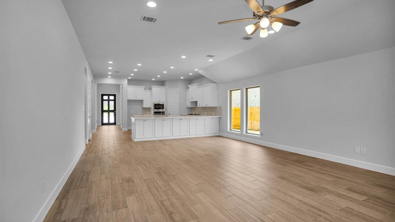 14952 Bright Berry Drive Conroe, TX 77302 - Photo 11 of 19 a view of a kitchen with a sink and a window