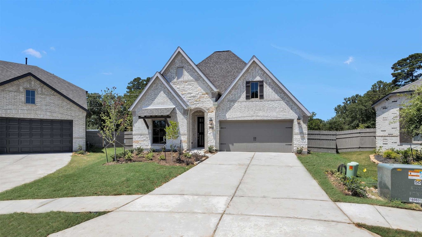 14952 Bright Berry Drive Conroe, TX 77302 - Photo 12 of 19 a front view of house with yard and green space