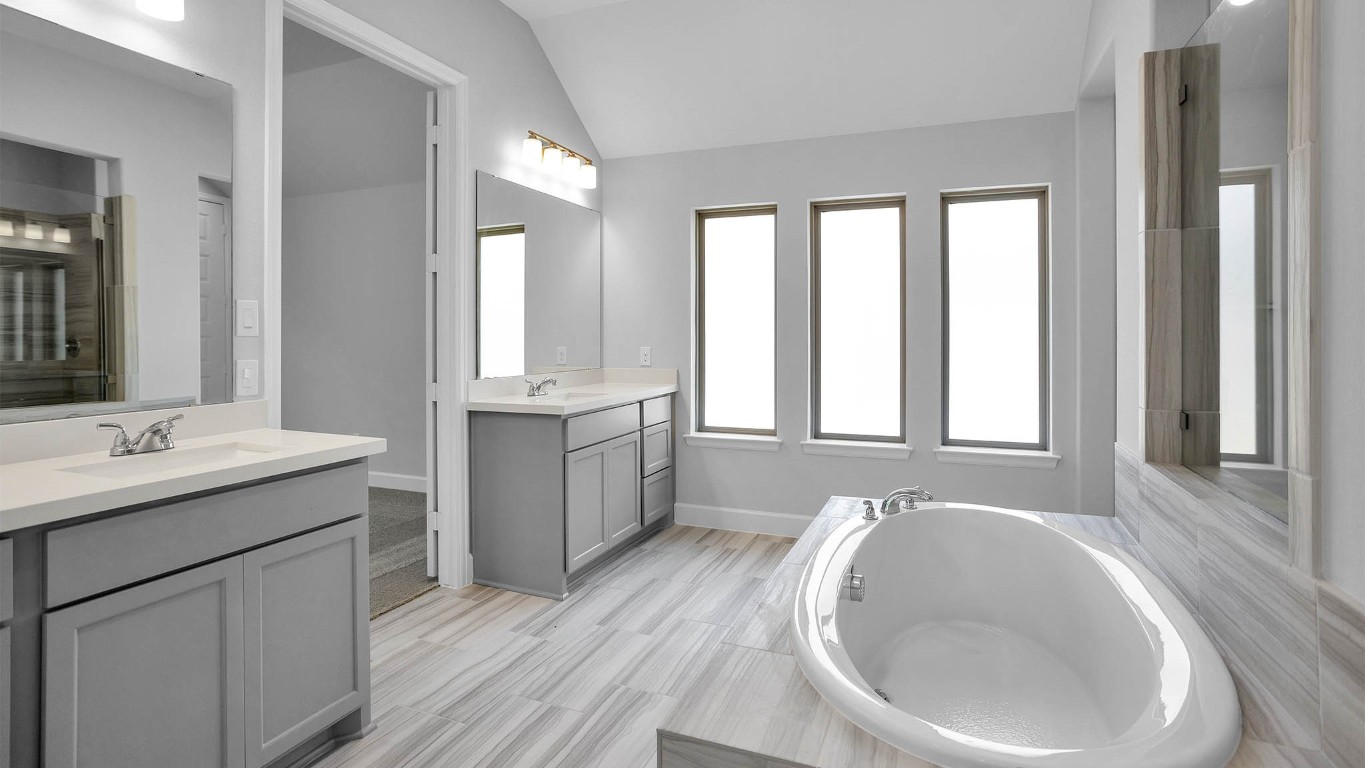 14952 Bright Berry Drive Conroe, TX 77302 - Photo 5 of 19 a bathroom with a sink and a bathtub