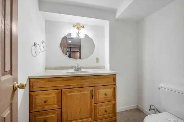 a bathroom with a sink a vanity and a mirror