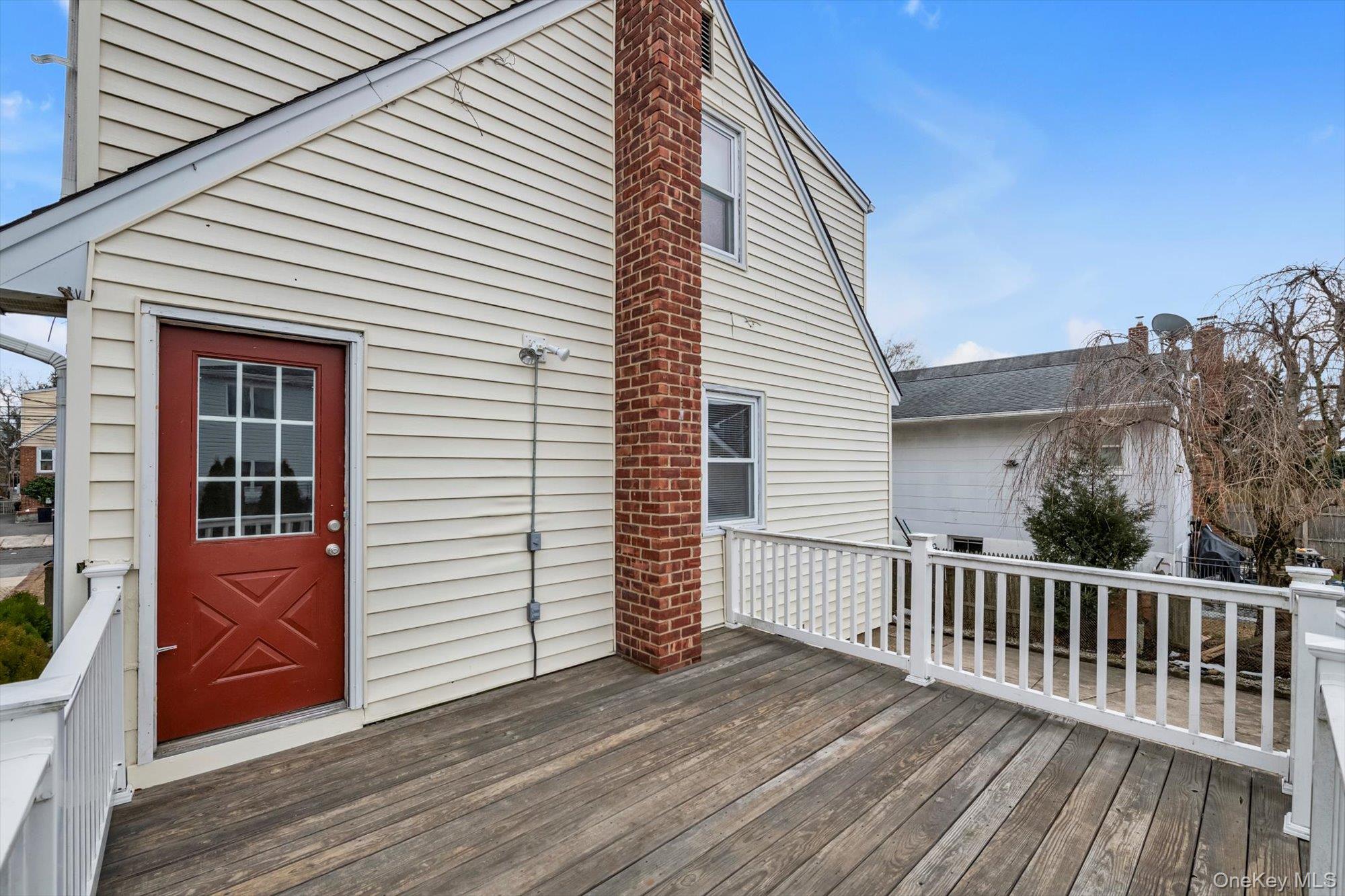 9 Graywood Road Port Washington, NY 11050 - Photo 17 of 23 a view of a house with a deck