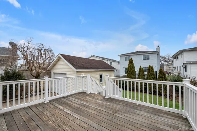 a view of a house with wooden deck