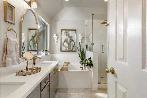 a view of bathroom with a tub sink and mirror