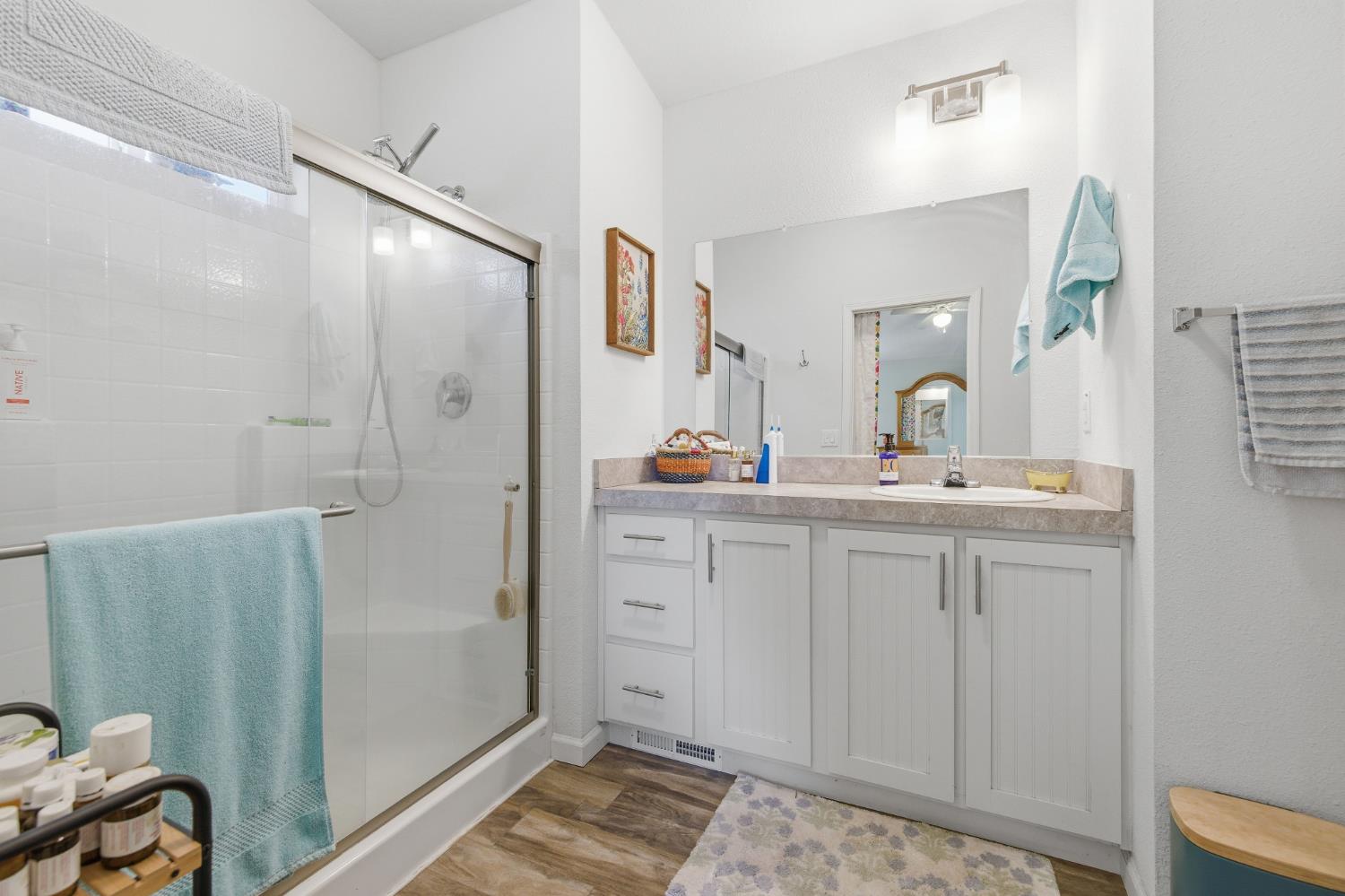 5015 Shooting Star Road Pollock Pines, CA 95726 - Photo 15 of 44 a bathroom with a double vanity sink and mirror