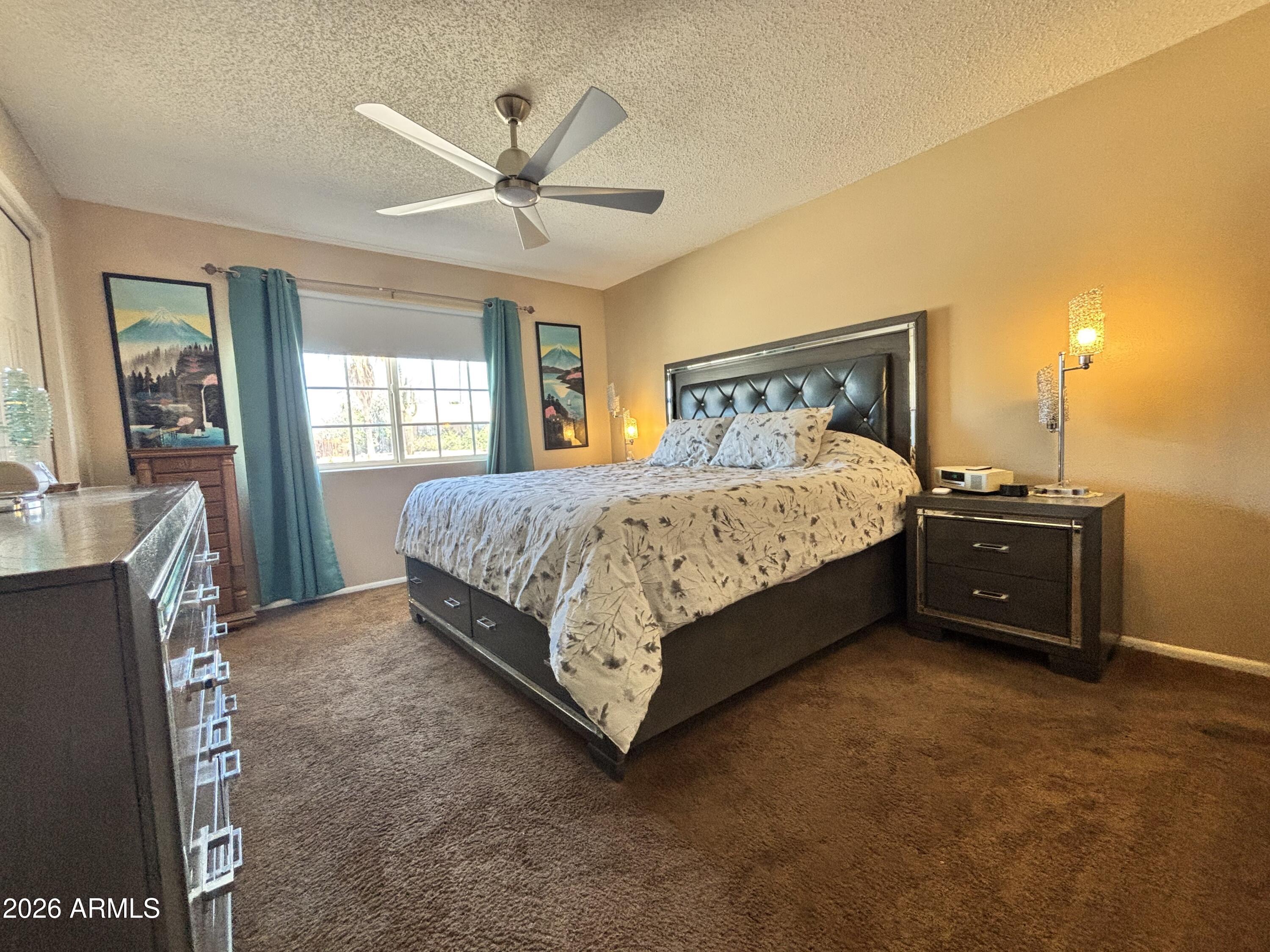7745 East Mangun Road Mesa, AZ 85207 - Photo 30 of 35 a bedroom with a bed and window