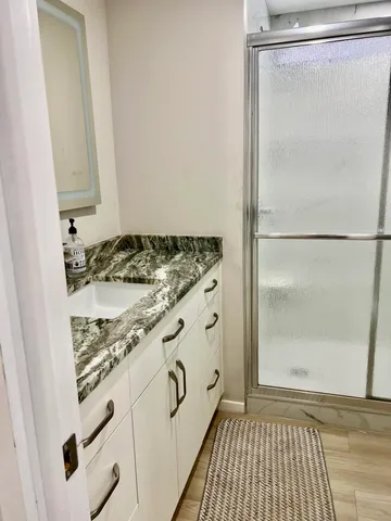 a view of hallway with wooden floor