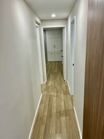 a large kitchen with stainless steel appliances lots of counter space and a sink