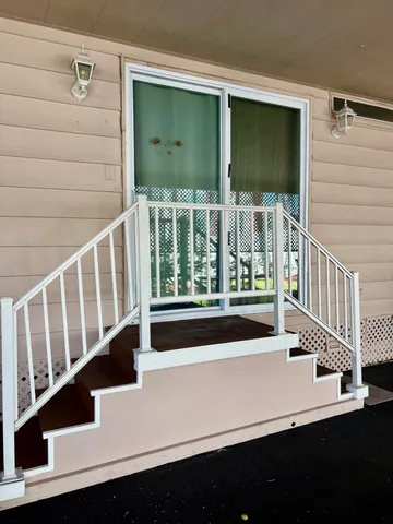 a view of balcony with wooden floor