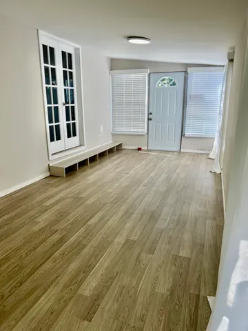 a view of a livingroom with wooden floor