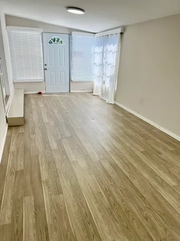 a view of entryway with wooden floor