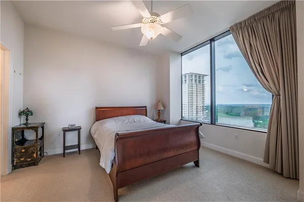 a bed sitting in a room next to a window