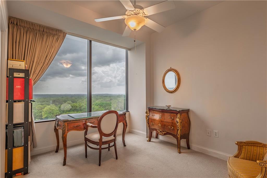 2828 Peachtree Road Northwest, Unit 1501 Atlanta, GA 30305 - Photo 15 of 30 a living room with furniture and a window