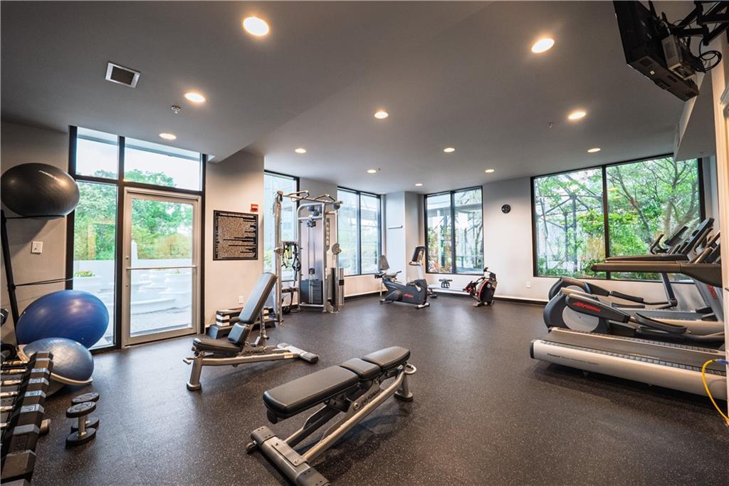 2828 Peachtree Road Northwest, Unit 1501 Atlanta, GA 30305 - Photo 22 of 30 a room with gym equipment and a large window