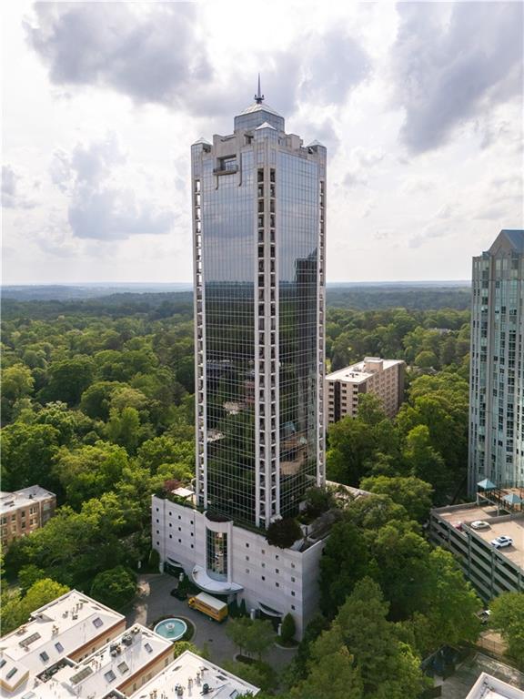 2828 Peachtree Road Northwest, Unit 1501 Atlanta, GA 30305 - Photo 28 of 30 a view of a garden with a building in the background