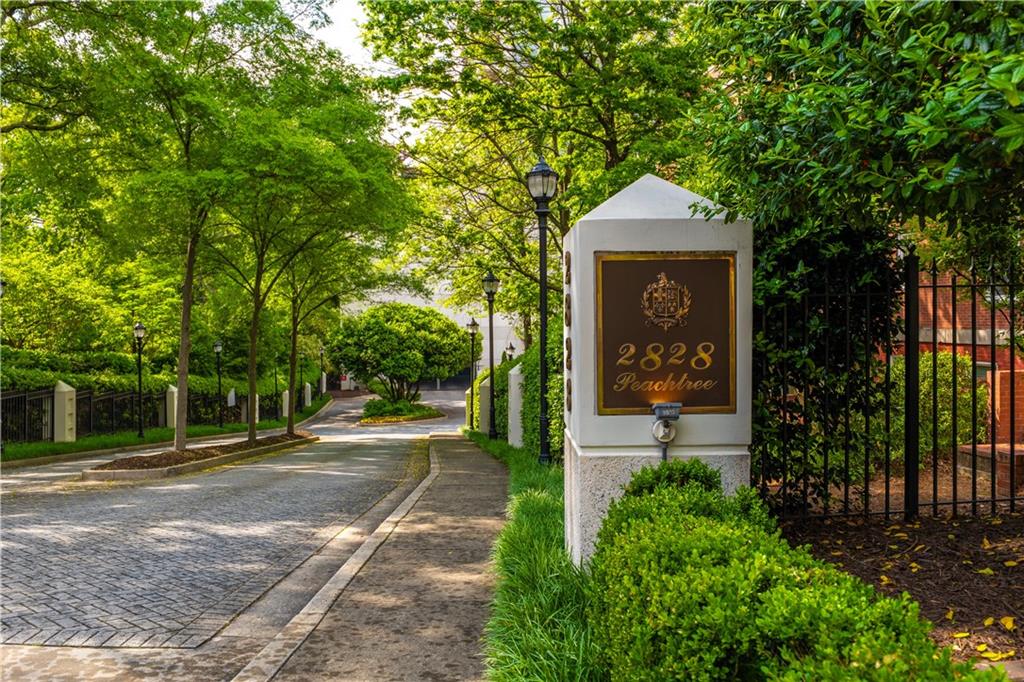 2828 Peachtree Road Northwest, Unit 1501 Atlanta, GA 30305 - Photo 30 of 30 a front view of a house with a garden
