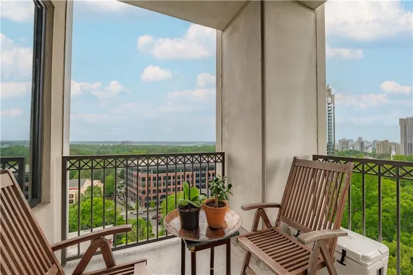 a view of balcony with furniture
