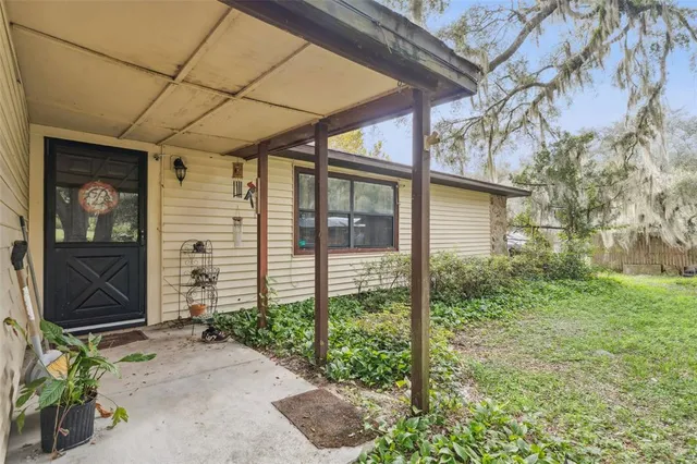 a backyard of a house with lots of green space