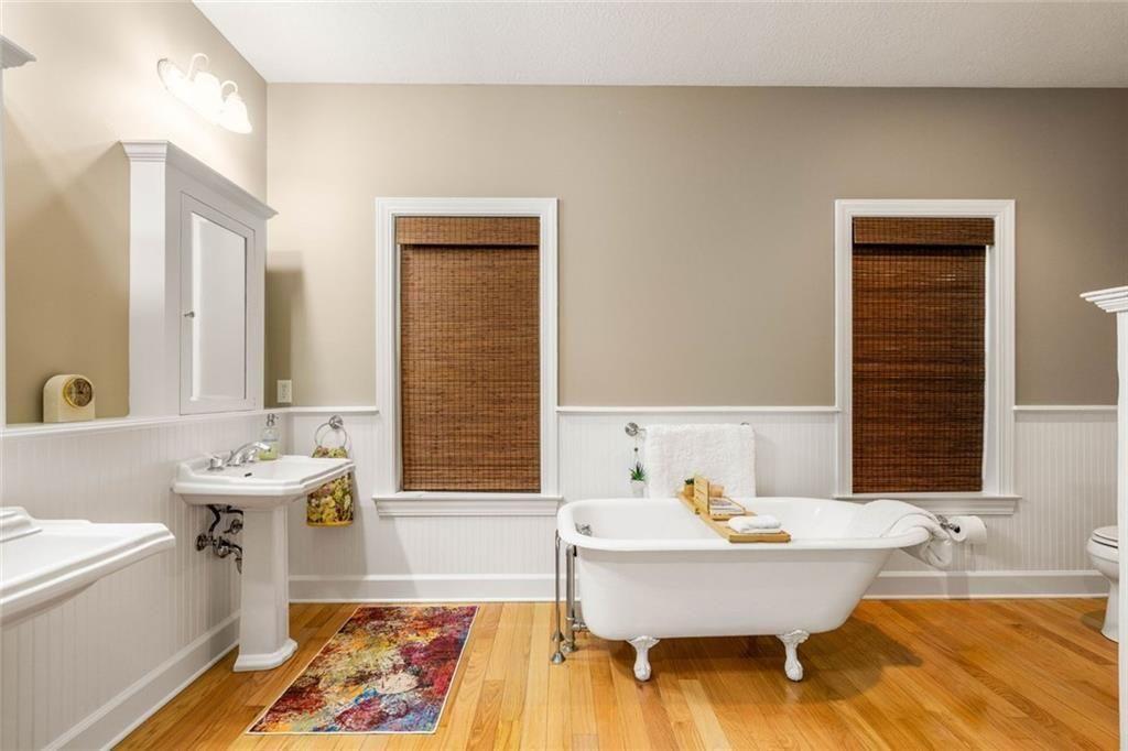 704 Riverbend Road Blairsville, GA 30512 - Photo 49 of 89 a bathroom with a tub sink and mirror