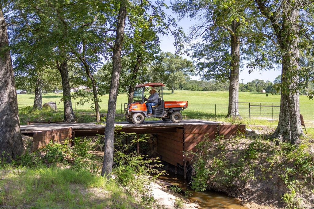 3104 County Road 3104 Edgewood, TX 75117 - Photo 17 of 24 a view of a swimming pool with a patio and a yard
