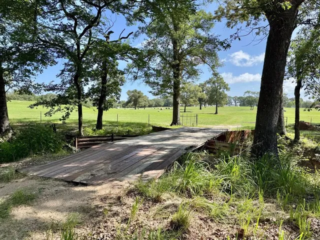 a view of swimming pool with a balcony
