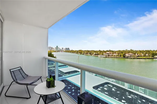 a terrace of a house with outdoor seating