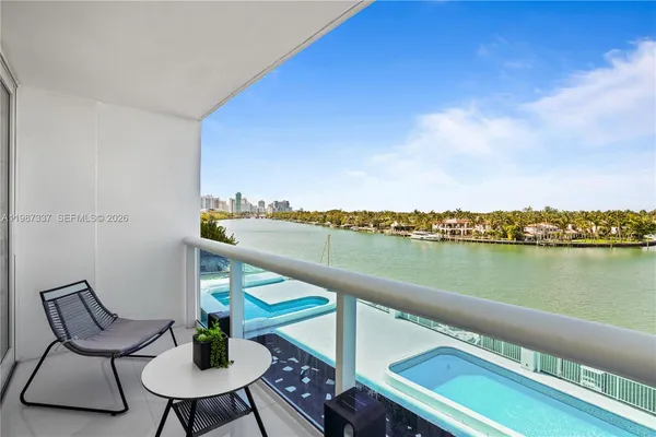 a terrace with outdoor seating and city view