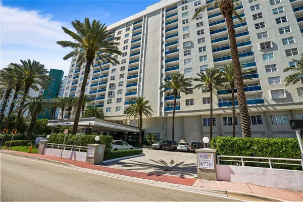 front view of a building with a garden