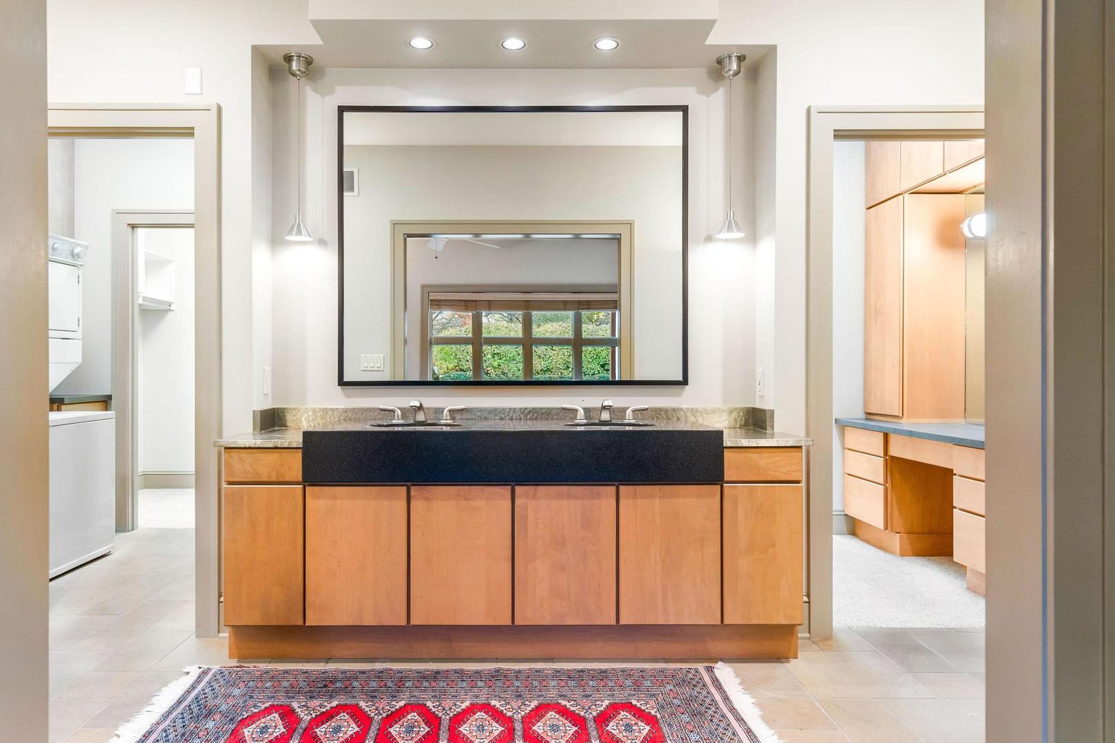 36 Sunset Road Bloomington, IL 61701 - Photo 17 of 67 a bathroom with a bathtub a mirror and a shower
