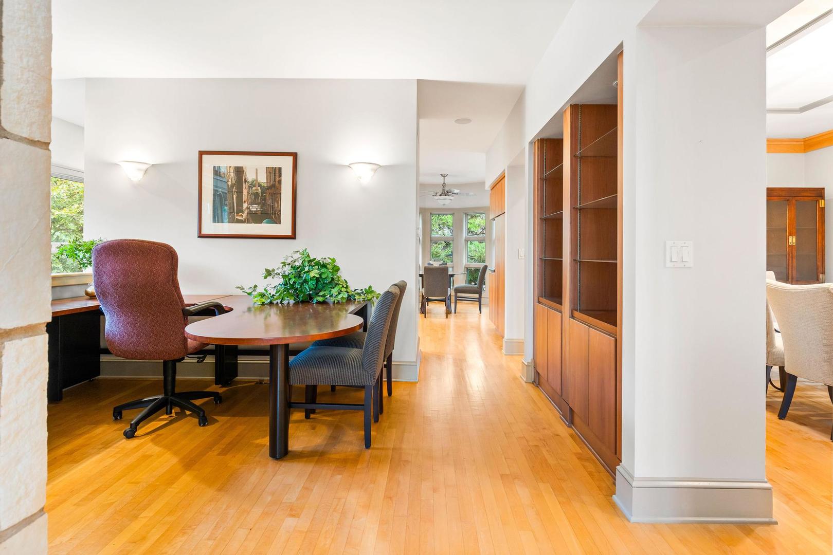 36 Sunset Road Bloomington, IL 61701 - Photo 19 of 67 a view of a workspace room with wooden floor and furniture