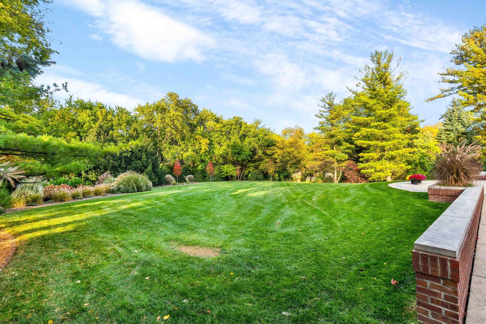 36 Sunset Road Bloomington, IL 61701 - Photo 35 of 67 a view of a garden with an tree