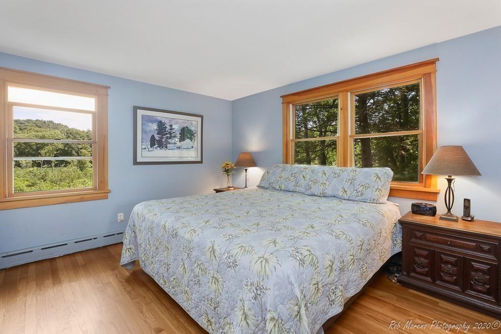 6 Pilgrim Road Hamilton, MA 01982 - Photo 13 of 32 a spacious bedroom with a bed and wooden floor