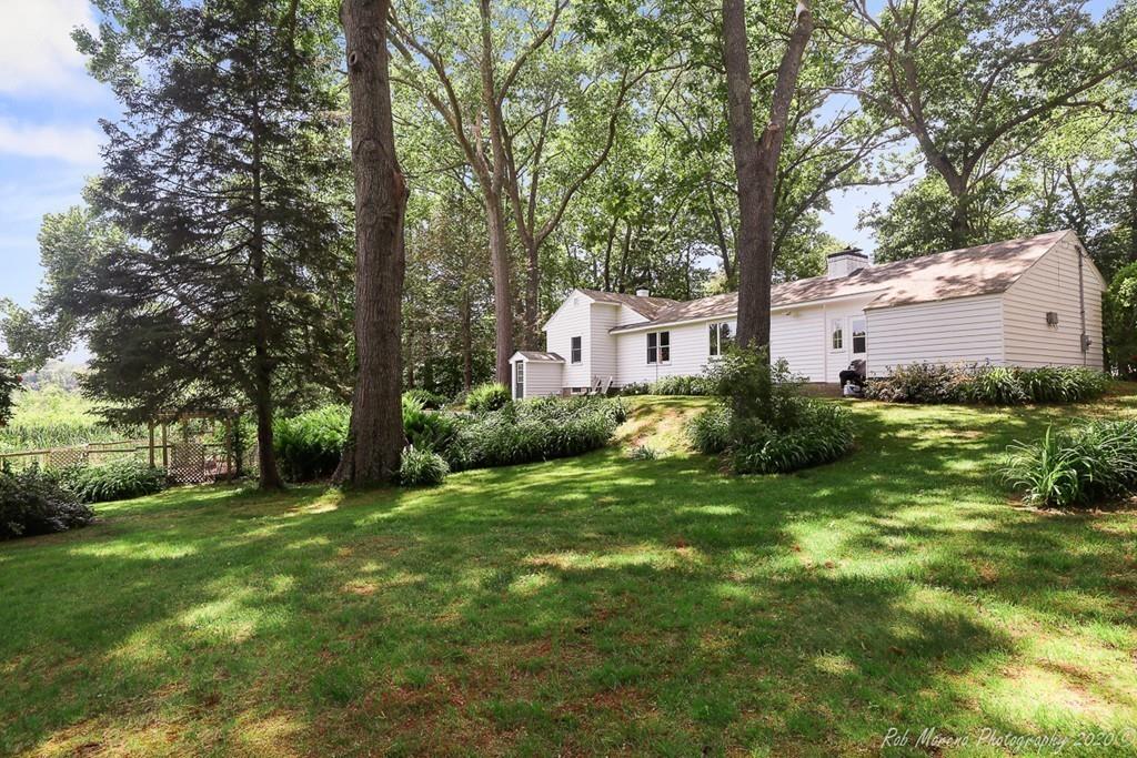 6 Pilgrim Road Hamilton, MA 01982 - Photo 16 of 32 a view of a house with a yard