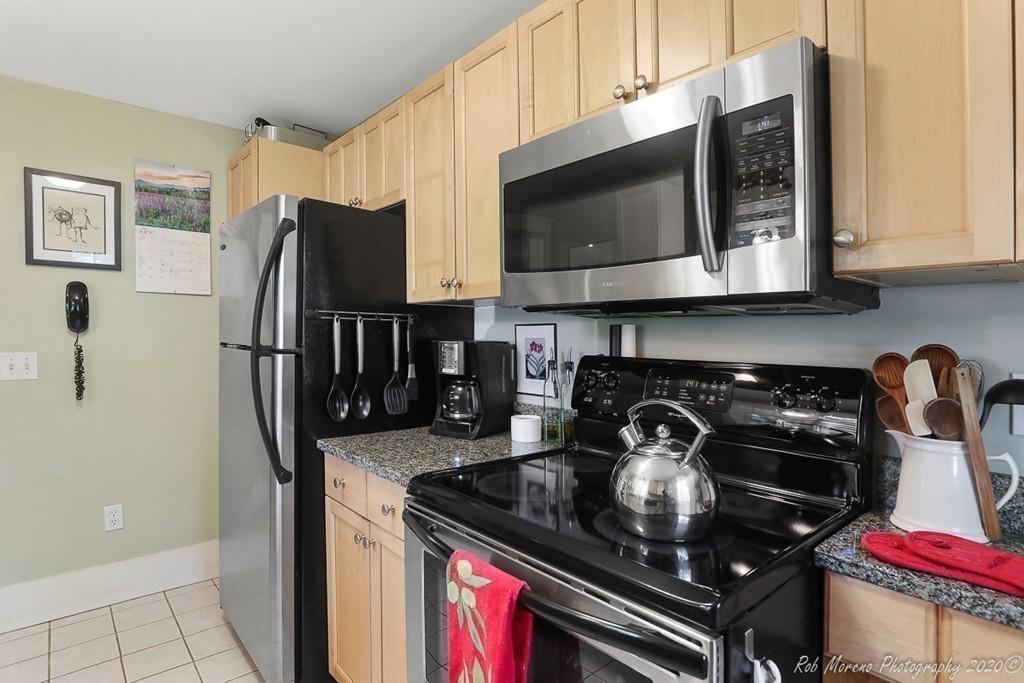 6 Pilgrim Road Hamilton, MA 01982 - Photo 5 of 32 a kitchen with stainless steel appliances granite countertop a stove and a microwave