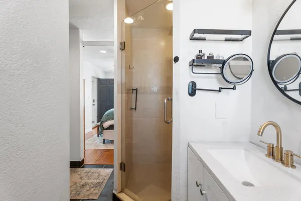 a bathroom with a sink and a mirror