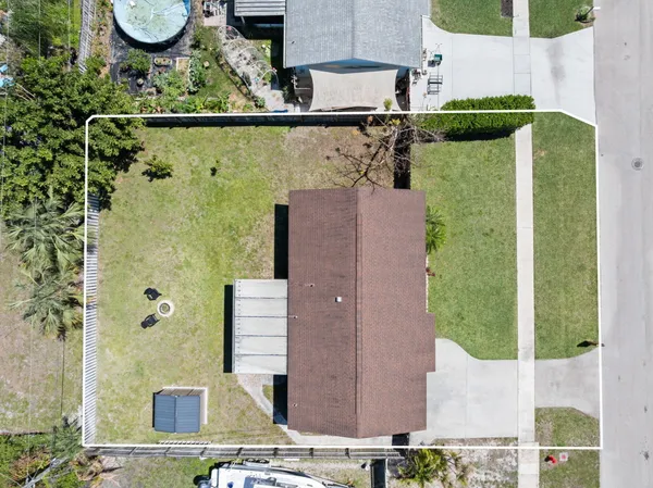 an aerial view of a residential houses with outdoor space