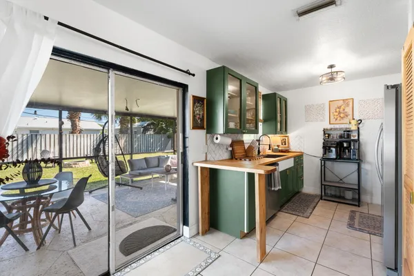 a kitchen with a table and chairs