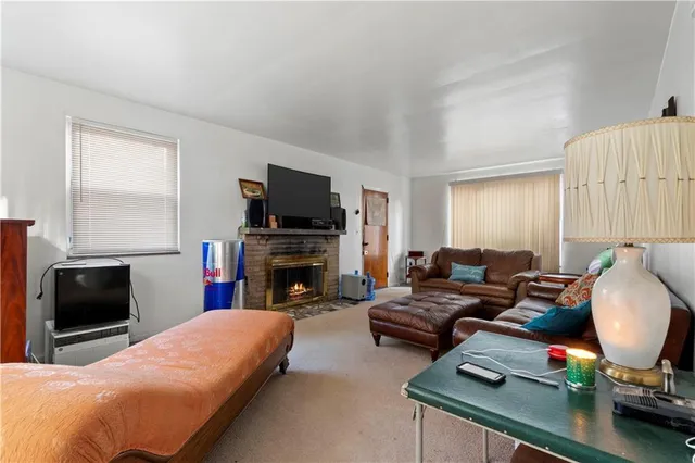 a bedroom with furniture and a flat screen tv