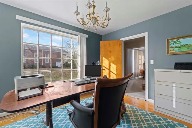 a room with chandelier furniture and windows