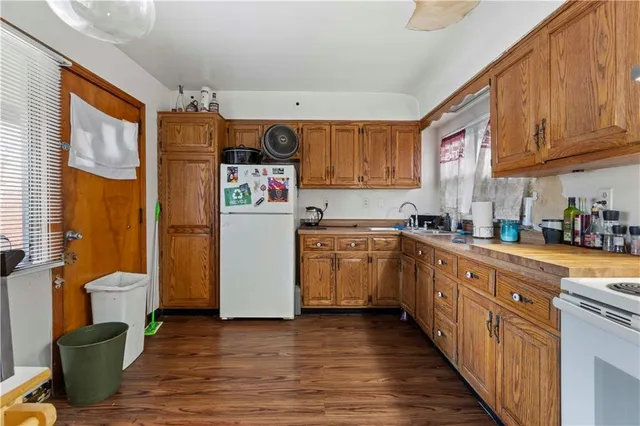 a kitchen with sink cabinets and window