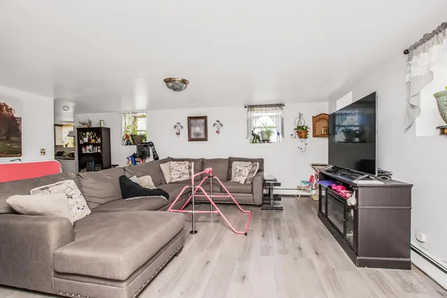 a kitchen with white cabinets and appliances