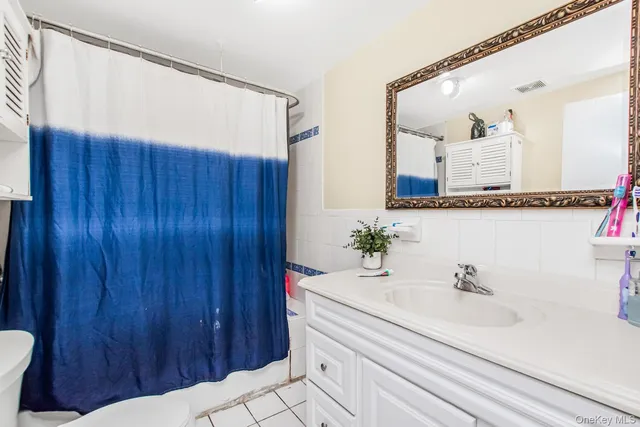 a bedroom with furniture and a wooden floor