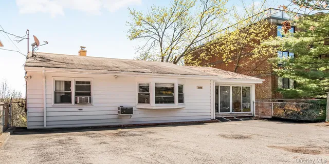 a backyard of a house with seating space