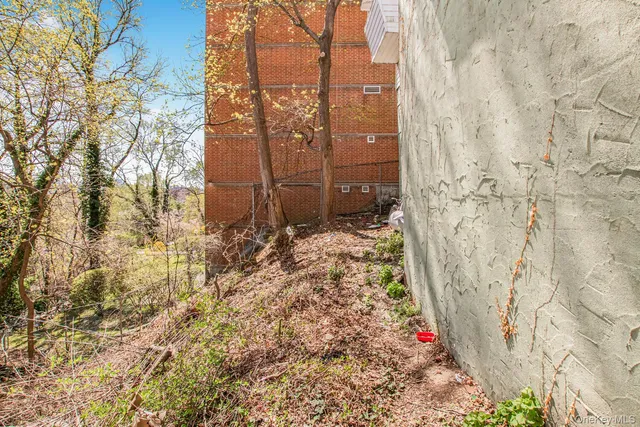a backyard of a house with a yard and outdoor seating