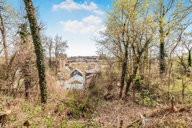 a kitchen with stainless steel appliances a sink a stove and a refrigerator